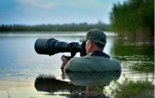 A professional wildlife photographer prepares for the shot of a lifetime on Lake Athapapuskow.