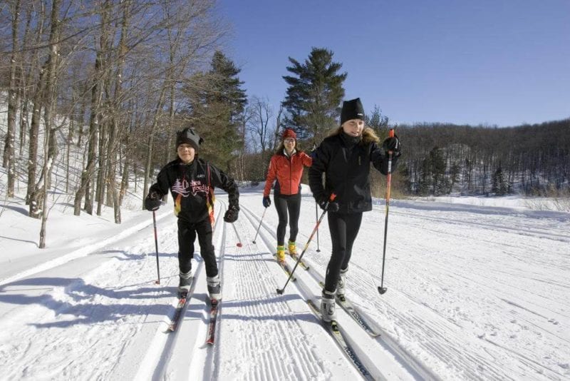 A trio of cross-country skiers makes their way through Northern Manitoba near Lake Athapapuskow.